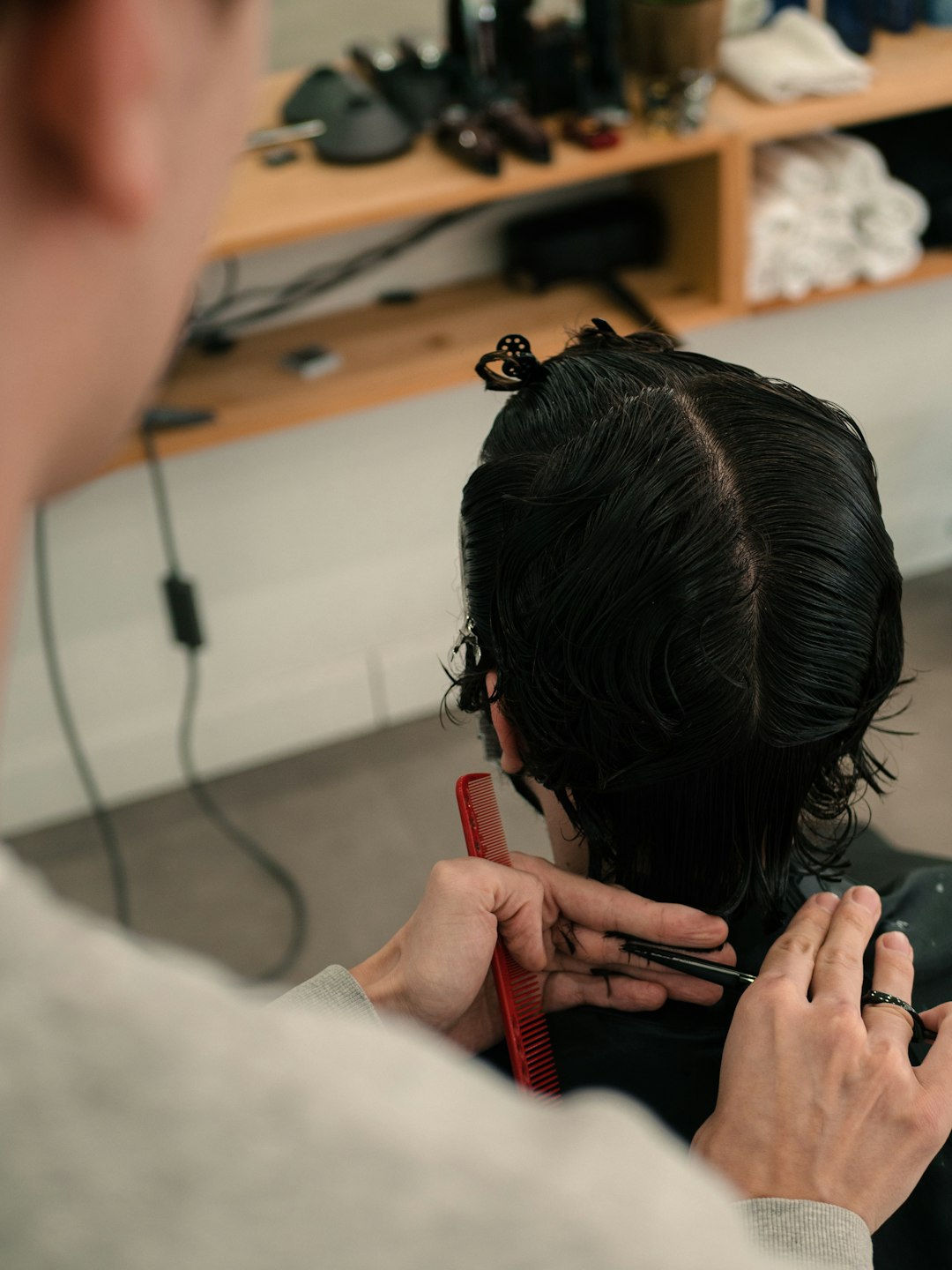 Professional stylist working with client