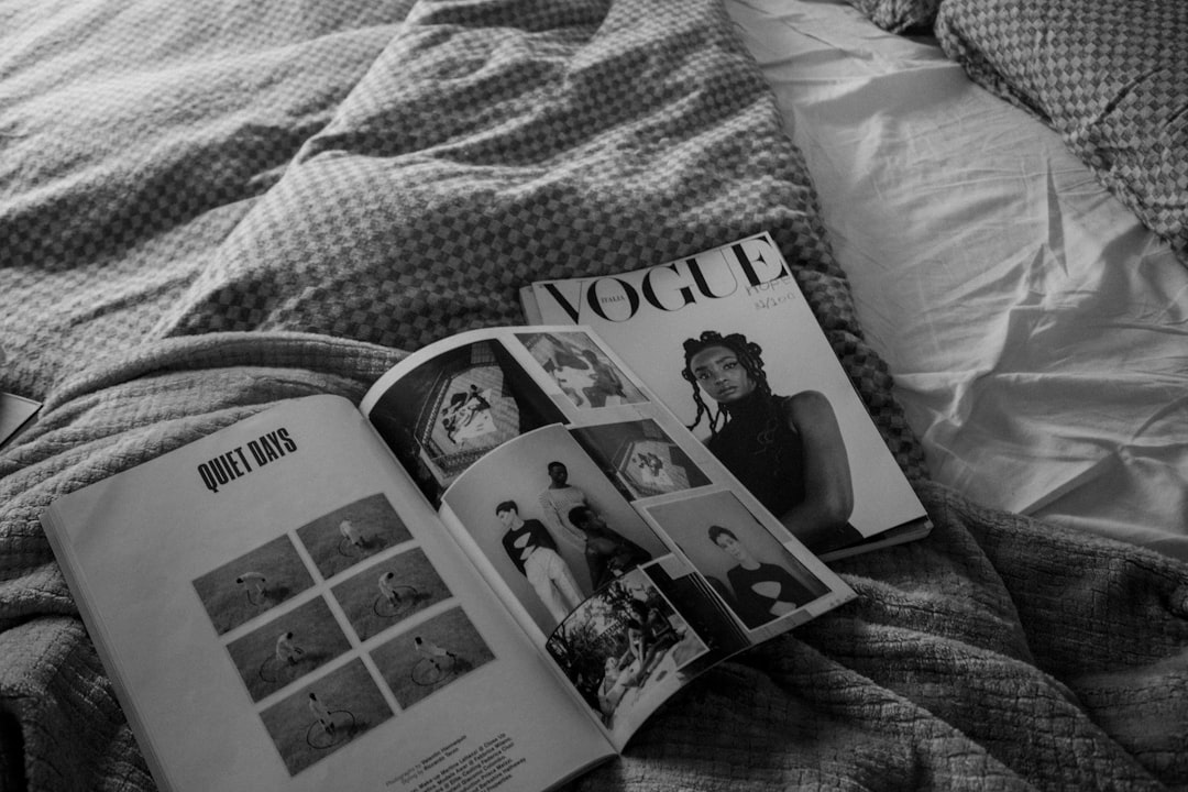 Essential capsule wardrobe items laid out on a bed